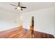 This bedroom features hardwood floors, neutral walls, and a ceiling fan at 620 Oakledge Nw Dr, Marietta, GA 30060