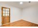 Entryway featuring hardwood floors, white walls, and a wood front door at 620 Oakledge Nw Dr, Marietta, GA 30060