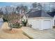 Charming single-story home with a white exterior, attached garage, and well-maintained front yard with American flag at 620 Oakledge Nw Dr, Marietta, GA 30060
