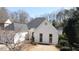 Charming single-Gathering home with white brick exterior and mature trees at 620 Oakledge Nw Dr, Marietta, GA 30060