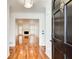 Inviting foyer with hardwood floors leading to a living room with a fireplace and a large window at 620 Oakledge Nw Dr, Marietta, GA 30060