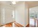 Bright foyer featuring hardwood floors, a white front door with sidelights, and a view into the adjacent living space at 620 Oakledge Nw Dr, Marietta, GA 30060