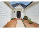 Front door of a home with a well-manicured lawn and walkway at 620 Oakledge Nw Dr, Marietta, GA 30060