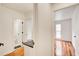 A bright hallway provides entry to a bathroom on the left and a bedroom with hardwood floors on the right at 620 Oakledge Nw Dr, Marietta, GA 30060