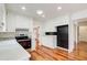 Bright kitchen featuring white cabinetry, stainless steel appliances, and hardwood flooring at 620 Oakledge Nw Dr, Marietta, GA 30060