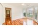 Bright living room with bay window, hardwood floors, and paneled wainscoting at 620 Oakledge Nw Dr, Marietta, GA 30060