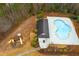 Aerial view of community pool, playground, and surrounding landscaping in a well-maintained area at 4492 Bryten Dr, Douglasville, GA 30135