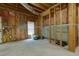 Unfinished basement with exposed insulation, wooden framing, and potential for customization at 4492 Bryten Dr, Douglasville, GA 30135