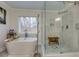 Modern bathroom with a freestanding tub and a walk-in shower at 4492 Bryten Dr, Douglasville, GA 30135