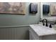 Modern bathroom featuring a marble vanity with a marble countertop and oil rubbed bronze fixtures at 4492 Bryten Dr, Douglasville, GA 30135