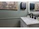 Bathroom features marble vanity and green walls at 4492 Bryten Dr, Douglasville, GA 30135