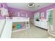 This ' bedroom features a bunk bed with a slide, dollhouse, and white dresser at 4492 Bryten Dr, Douglasville, GA 30135