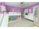 bedroom with purple walls and a bunk bed with a slide at 4492 Bryten Dr, Douglasville, GA 30135