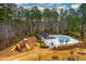 Community pool and playground area featuring a pool house and various recreational amenities at 4492 Bryten Dr, Douglasville, GA 30135