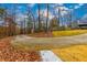 Long driveway leading to the home, surrounded by mature trees and landscaping at 4492 Bryten Dr, Douglasville, GA 30135