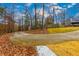 Curved driveway leading to a house with landscaping at 4492 Bryten Dr, Douglasville, GA 30135