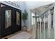 Bright and airy entryway with black double doors and a view of the staircase at 4492 Bryten Dr, Douglasville, GA 30135