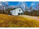 White house with deck and two-car garage at 4492 Bryten Dr, Douglasville, GA 30135
