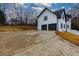 White house with two-car garage and large driveway at 4492 Bryten Dr, Douglasville, GA 30135