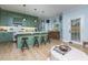 Modern kitchen with sage green cabinets, white countertops, and an island at 4492 Bryten Dr, Douglasville, GA 30135