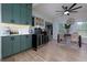 Kitchen area with green cabinets and a large refrigerator and wine storage at 4492 Bryten Dr, Douglasville, GA 30135