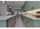 Spacious kitchen with marble countertops, stainless steel appliances, and green cabinets at 4492 Bryten Dr, Douglasville, GA 30135