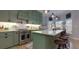 Modern kitchen with an island, stainless steel appliances, and green cabinetry at 4492 Bryten Dr, Douglasville, GA 30135