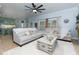 Inviting living room features a plush couch, large windows, and neutral decor at 4492 Bryten Dr, Douglasville, GA 30135