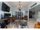 Comfortable living room with modern light fixtures, a workstation, and open access to the entryway at 4492 Bryten Dr, Douglasville, GA 30135