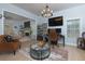Spacious living room with ample natural light, a decorative fireplace, and stylish furnishings at 4492 Bryten Dr, Douglasville, GA 30135