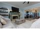 Cozy living room with fireplace, light blue walls, and comfortable furniture at 4492 Bryten Dr, Douglasville, GA 30135
