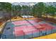 Well-maintained community tennis courts next to a playground and sparkling blue swimming pool at 4492 Bryten Dr, Douglasville, GA 30135