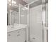Bathroom with shower and white vanity at 6196 Windflower Dr, Powder Springs, GA 30127
