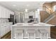 Eat-in kitchen with island seating and stainless steel appliances at 6196 Windflower Dr, Powder Springs, GA 30127