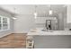 Kitchen features an island with seating, looking toward the dining area at 6196 Windflower Dr, Powder Springs, GA 30127