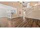 Open living room with kitchen views and hardwood floors at 6196 Windflower Dr, Powder Springs, GA 30127