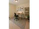 Bright home office featuring a sleek desk, modern chair, stylish shelving, and minimalist decor at 6196 Windflower Dr, Powder Springs, GA 30127