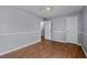 Bright bedroom with wood floors and access to hallway at 5667 Kingsport Dr, Atlanta, GA 30342