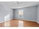 Spacious bedroom with wood floors and large window at 5667 Kingsport Dr, Atlanta, GA 30342