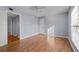 Bright bedroom with hardwood floors and ceiling fan at 5667 Kingsport Dr, Atlanta, GA 30342
