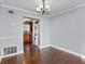 Dining room features hardwood floors and laundry in kitchen at 5667 Kingsport Dr, Atlanta, GA 30342