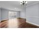 Bright dining room with hardwood floors and sliding door at 5667 Kingsport Dr, Atlanta, GA 30342