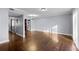 Hardwood floor dining room with kitchen and hallway access at 5667 Kingsport Dr, Atlanta, GA 30342