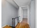 Hallway with wood floors and access to bedroom at 5667 Kingsport Dr, Atlanta, GA 30342