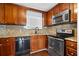 Kitchen with wood cabinets and granite countertops at 5667 Kingsport Dr, Atlanta, GA 30342