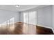 Spacious living room with hardwood floors and sliding doors at 5667 Kingsport Dr, Atlanta, GA 30342