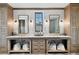 Spa-like bathroom with double vanity, marble counters, and herringbone floors at 6870 Colfax Ave, Cumming, GA 30040