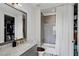 Bathroom with gray tile shower, marble vanity, and white curtain at 6870 Colfax Ave, Cumming, GA 30040