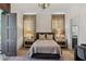 Bright bedroom with ample natural light, a cozy bed and en-suite bath access at 6870 Colfax Ave, Cumming, GA 30040