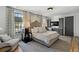 Bright bedroom featuring a king-size bed and ample natural light at 6870 Colfax Ave, Cumming, GA 30040